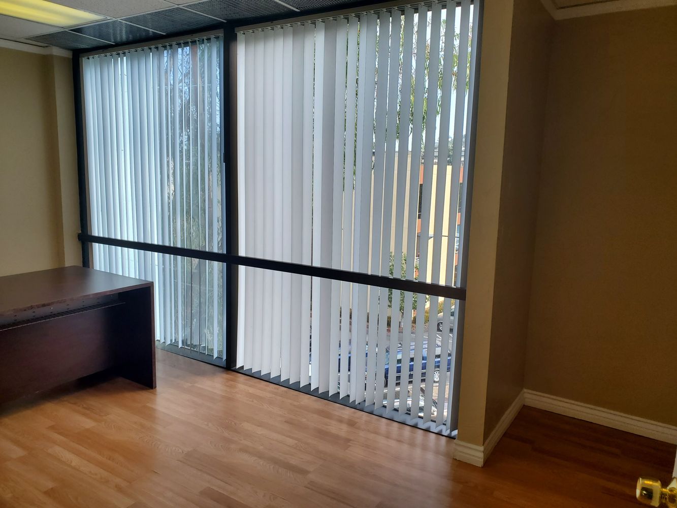 TILE AND WOOD FLOOR RECEPTION AREA. 5 OFFICES AND LARGE ROOM